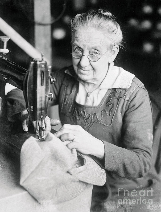 Woman Sewing A Cap Photograph by Bettmann Woman Sewing A Cap Photograph by Bettmann