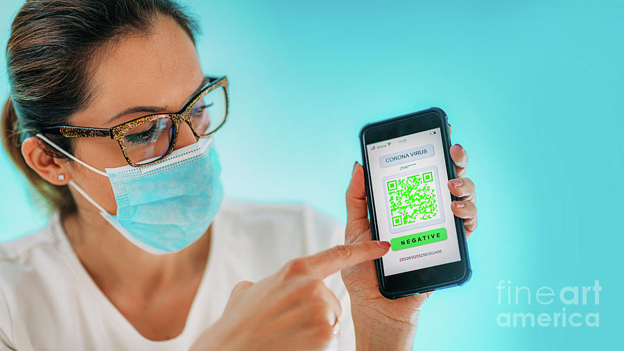 Woman Showing Smartphone With Coronavirus App Photograph by Microgen Images/science Photo Library