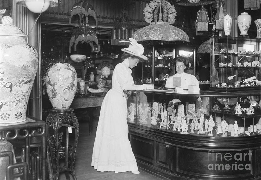Woman Signing Card In Curio Shop Photograph by Bettmann