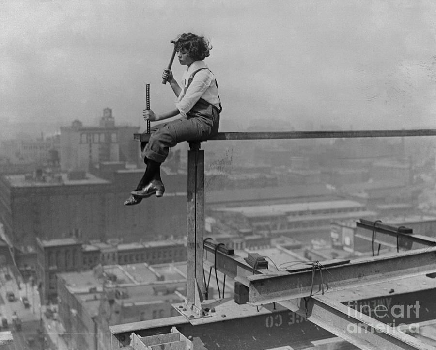 Woman Sitting On Beam Photograph by Bettmann
