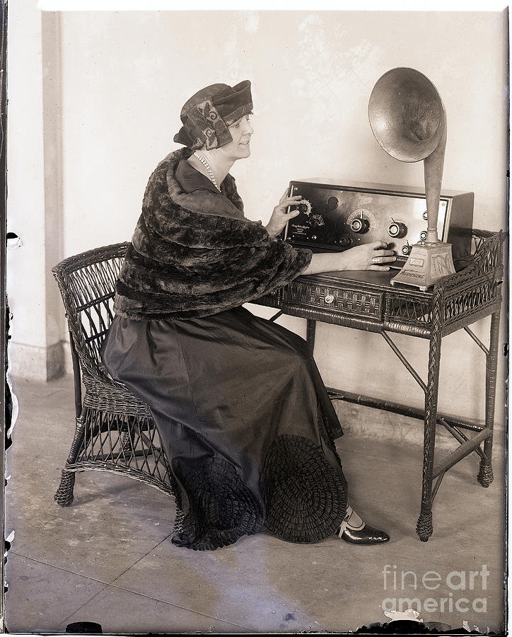 Woman Sitting With Audio Equipment Photograph by Bettmann