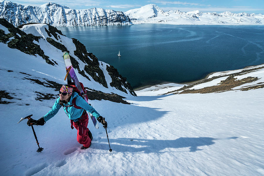 Woman Skinning Up Mountain To Ski In Svalbard Photograph by Cavan Images