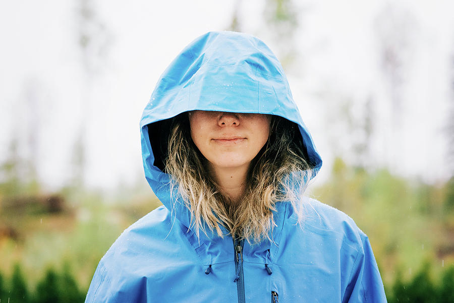 Woman Standing In The Rain With Her Hood Over Her Eyes Photograph by ...