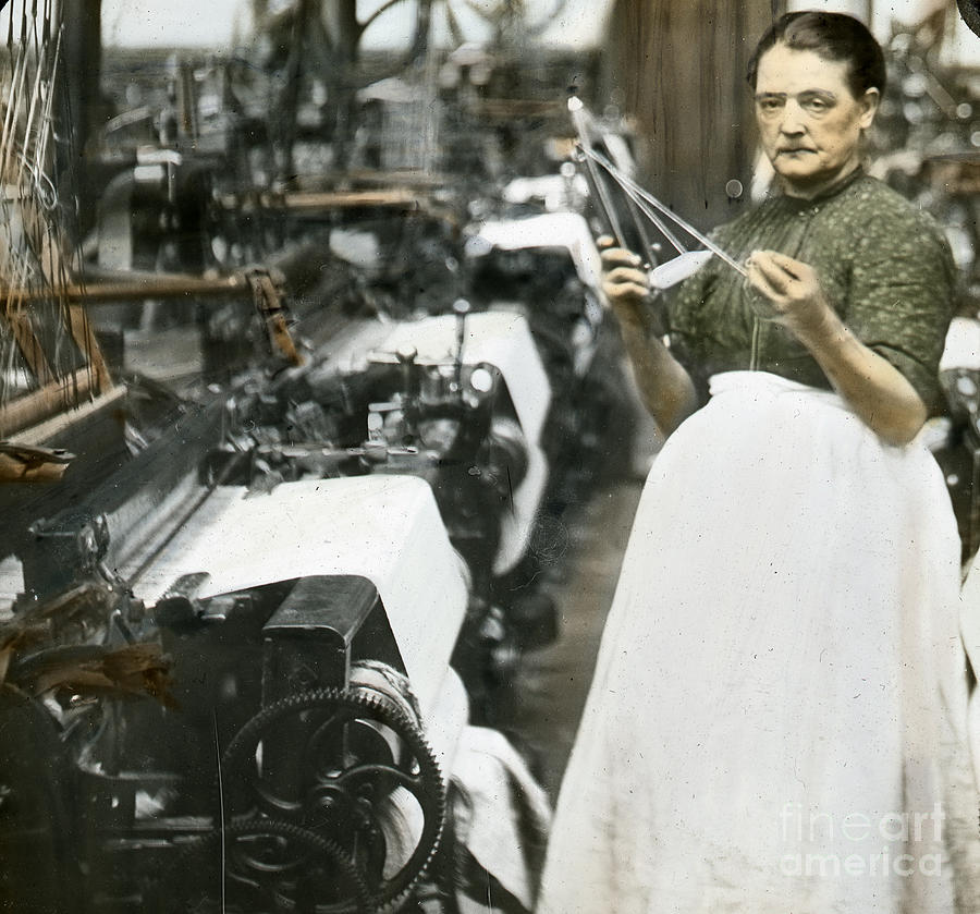 Woman Stands At A Loom In A Textile Mill Holding A Weaving Shuttle Photograph by English Photographer