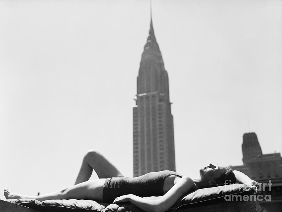 Woman Sun Bathing In Manhattan Photograph by Bettmann