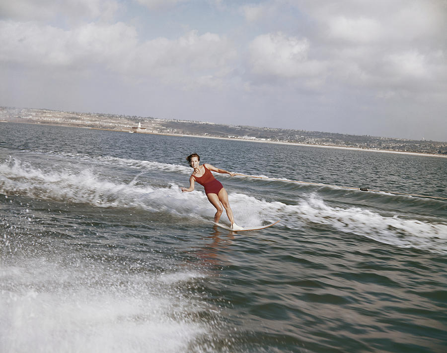 Woman Surfing On Sea Photograph by Tom Kelley Archive