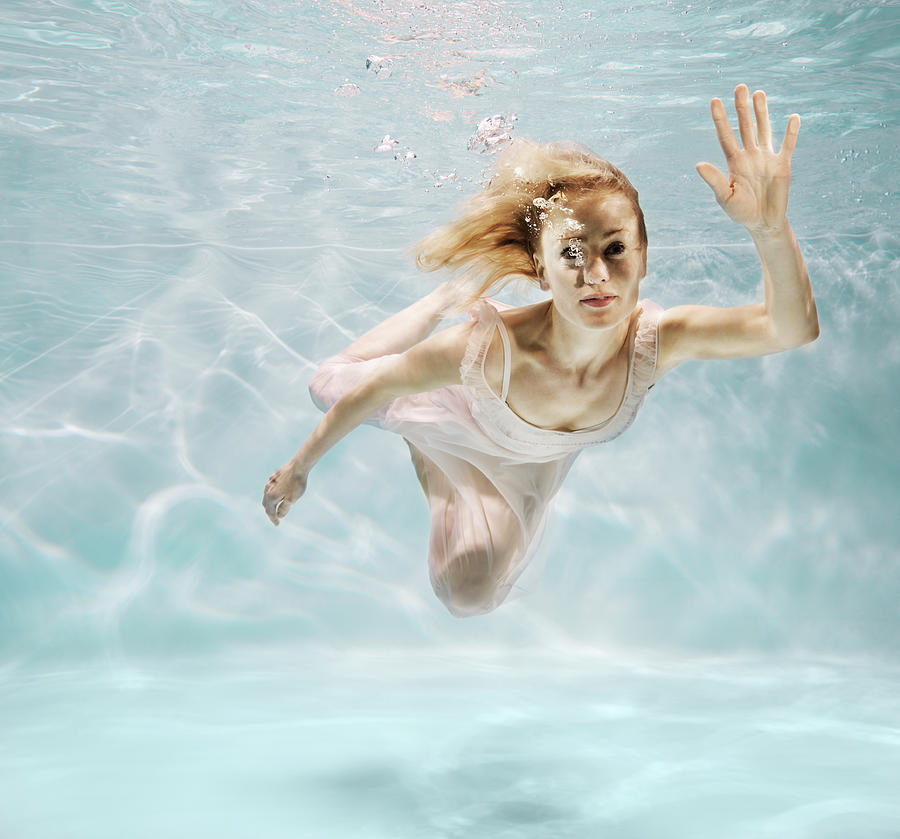 Woman Swimming Underwater Photograph by Henrik Sorensen