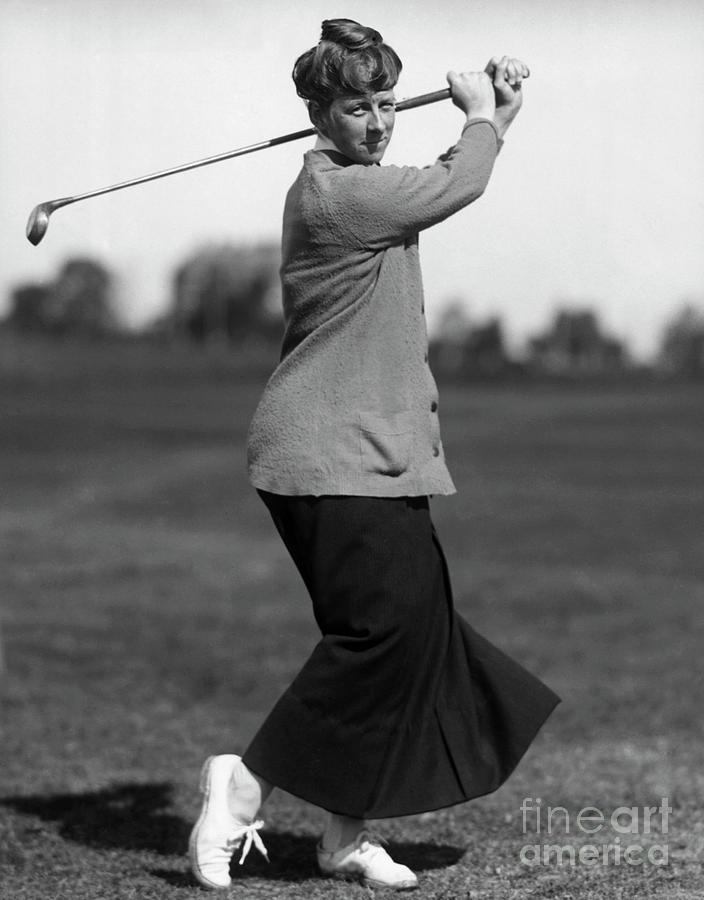 Woman Swinging A Golf Club Photograph by Bettmann