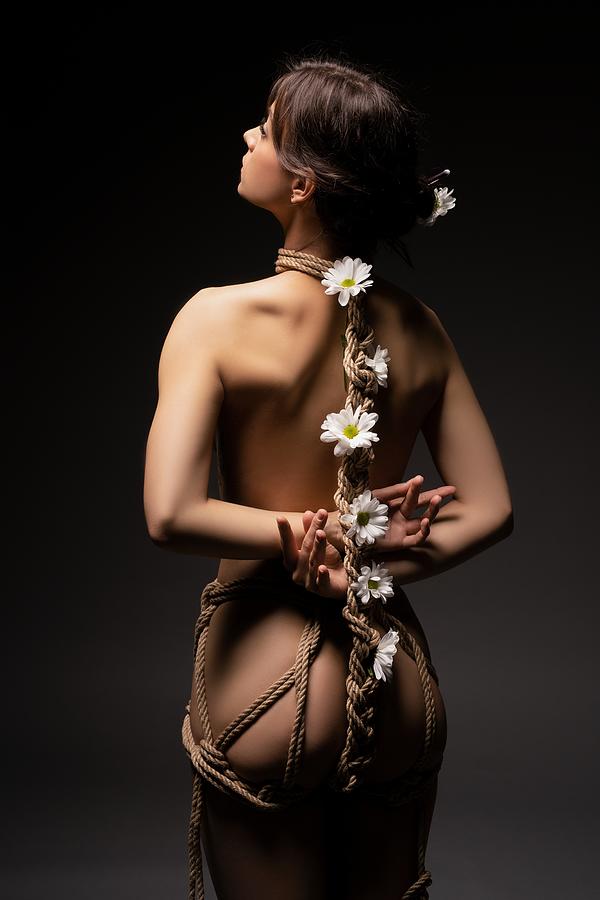 Woman Tied With Ropes And Flowers Photograph by Andrey Guryanov