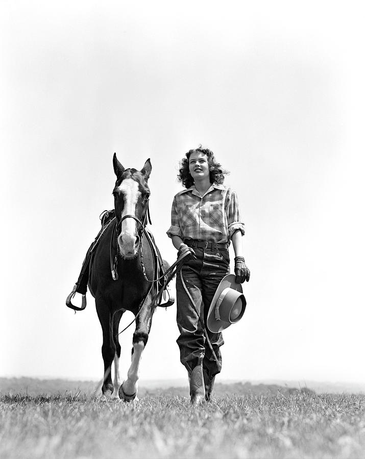 Woman Walking Beside Horse Holding Photograph by H. Armstrong Roberts
