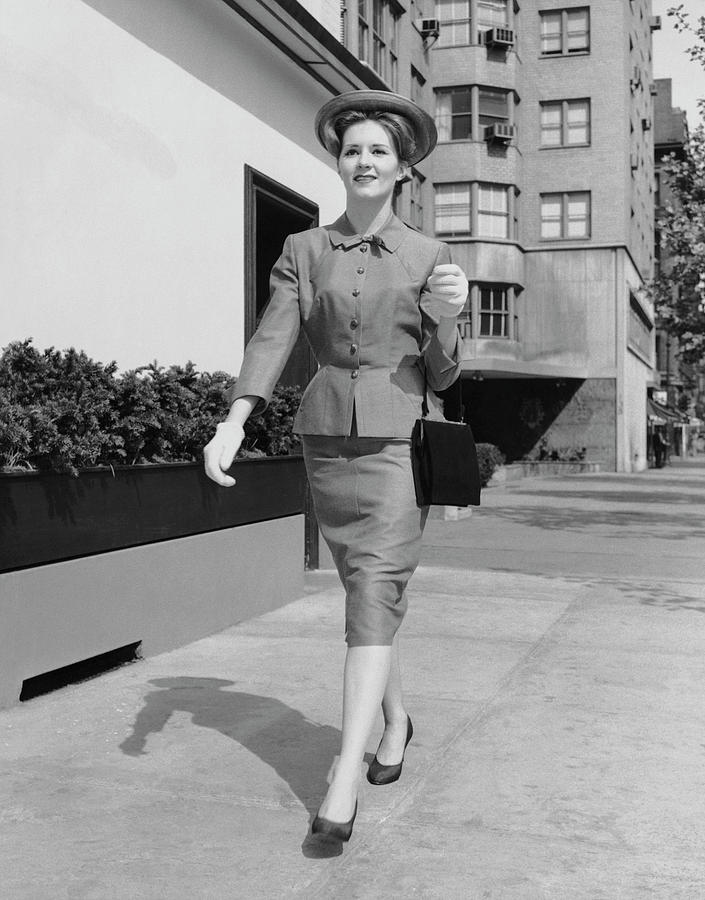 Woman Walking Down Sidewalk Photograph by George Marks