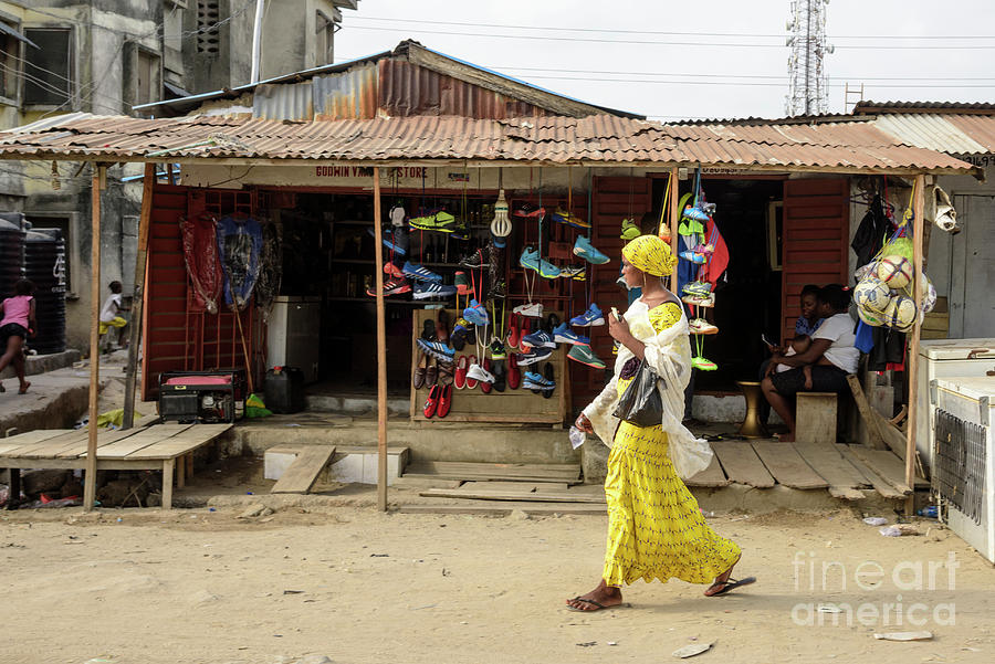 Woman Walking In Lekki, Lagos, Nigeria Photograph by Johnnygreig