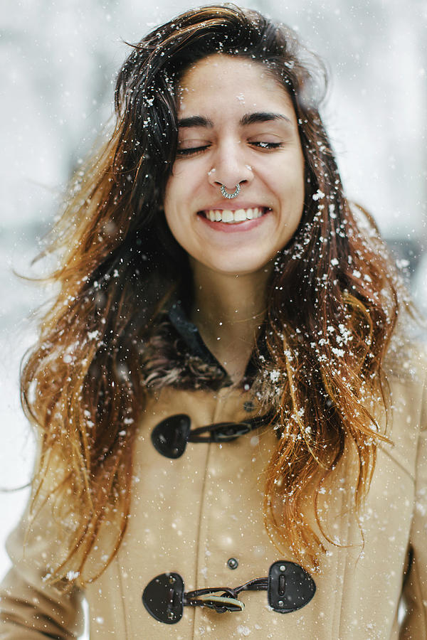 Woman Wearing Duffle Coat In Snow, Eyes Closed Smiling Digital Art by ...