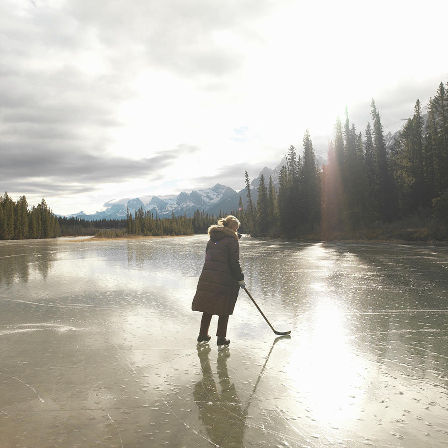 Woman Wearing Ice Skates On Lake Photograph by Ascent/pks Media Inc. Woman Wearing Ice Skates On Lake Photograph by Ascent/pks Media Inc.