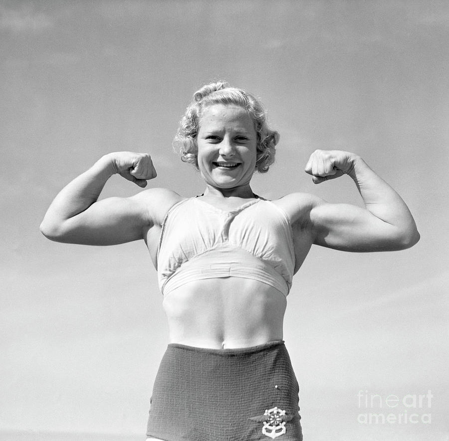 woman weight lifter in typical pose bettmann