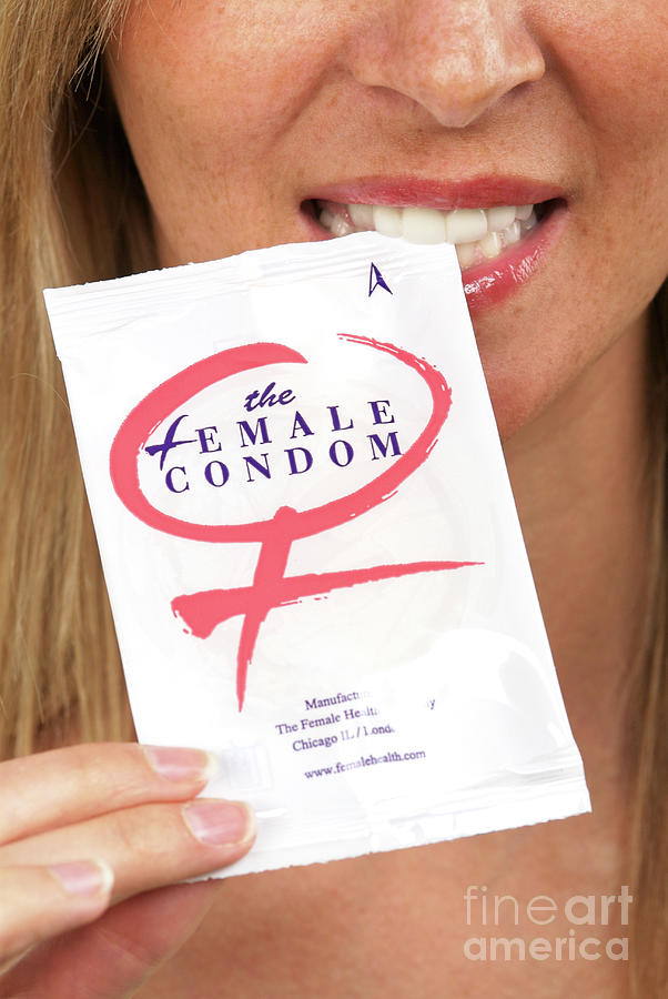 Woman With A Female Condom Packet Photograph by Lea Paterson/science Photo Library
