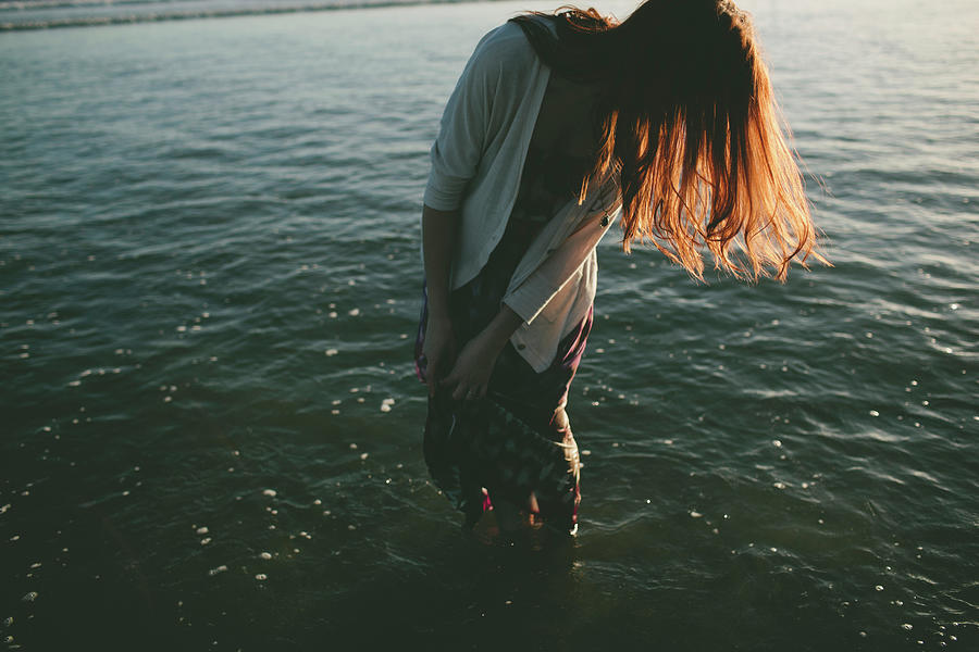 Woman With Brown Hair Standing In Sea Photograph By Cavan Images - Fine 