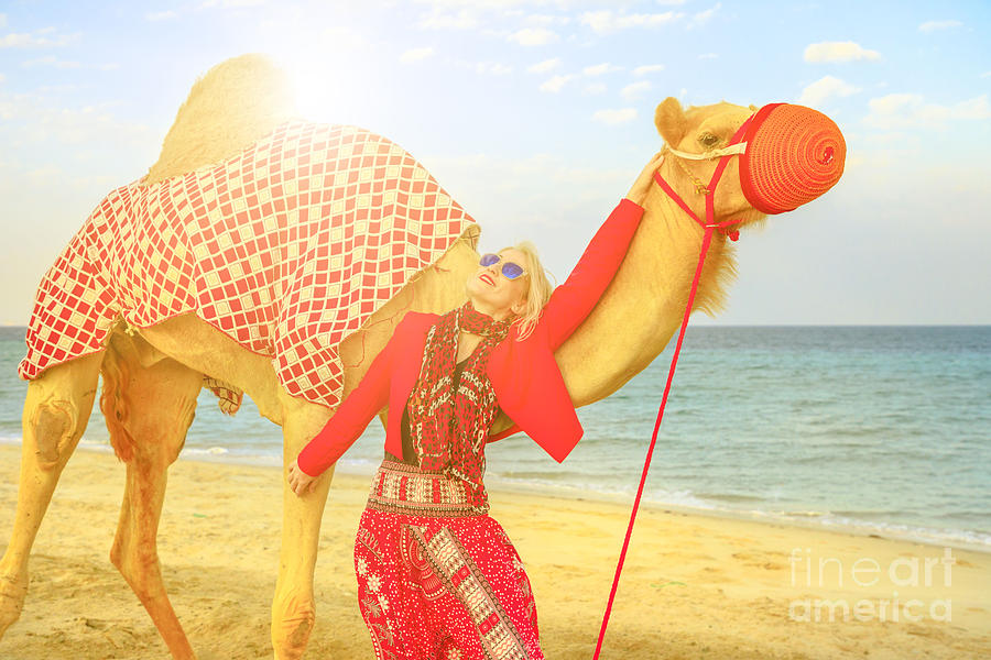 Woman with camel at sunset Photograph by Benny Marty