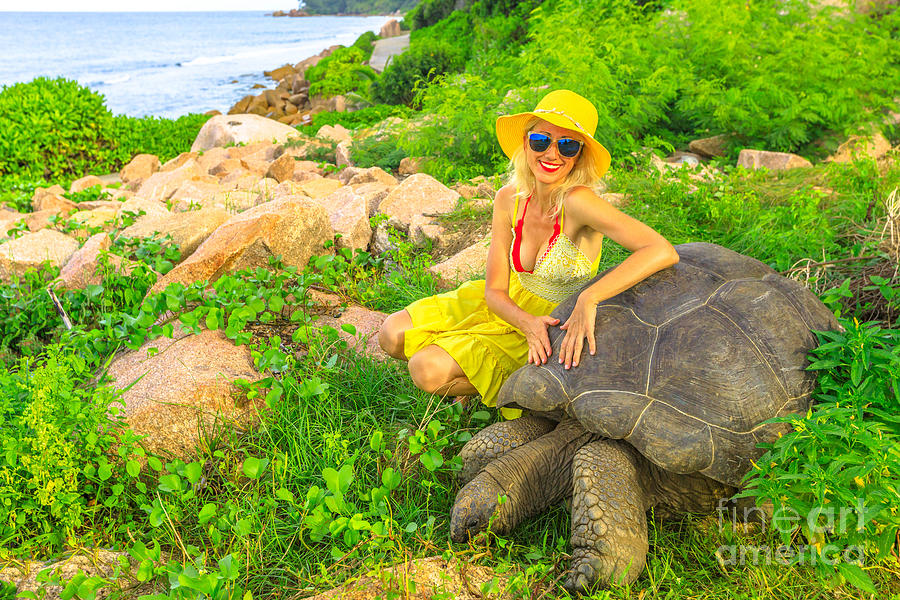 Woman with giant tortoise Photograph by Benny Marty