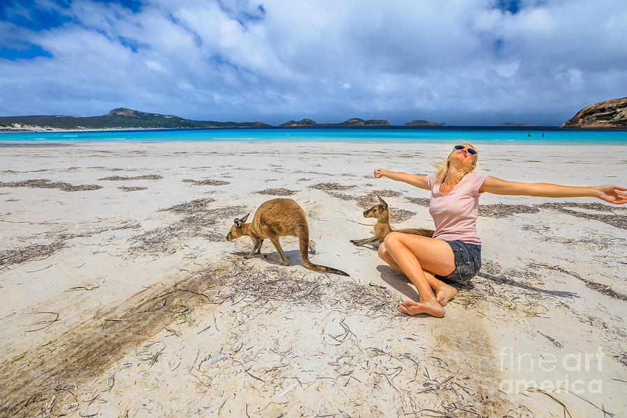 Woman with kangaroos at Lucky Bay Photograph by Benny Marty