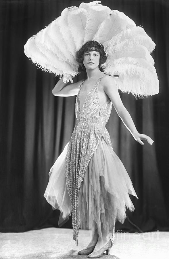 Woman With Large Feather Fan Wearing by Bettmann