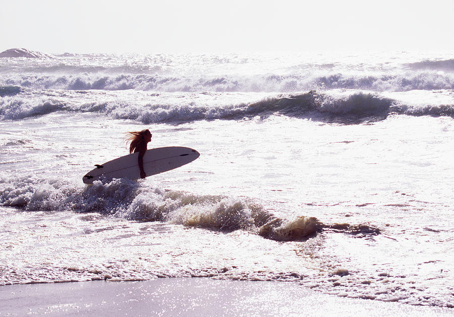 Woman With Surfboard In Sea Photograph by Johner Images