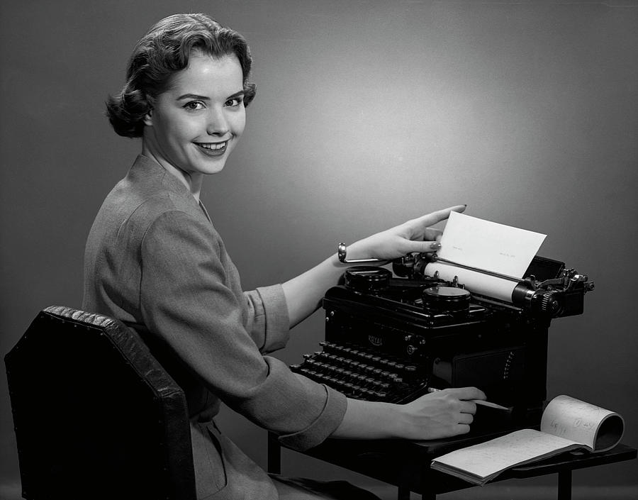 Woman Working At Typewriter Photograph by George Marks