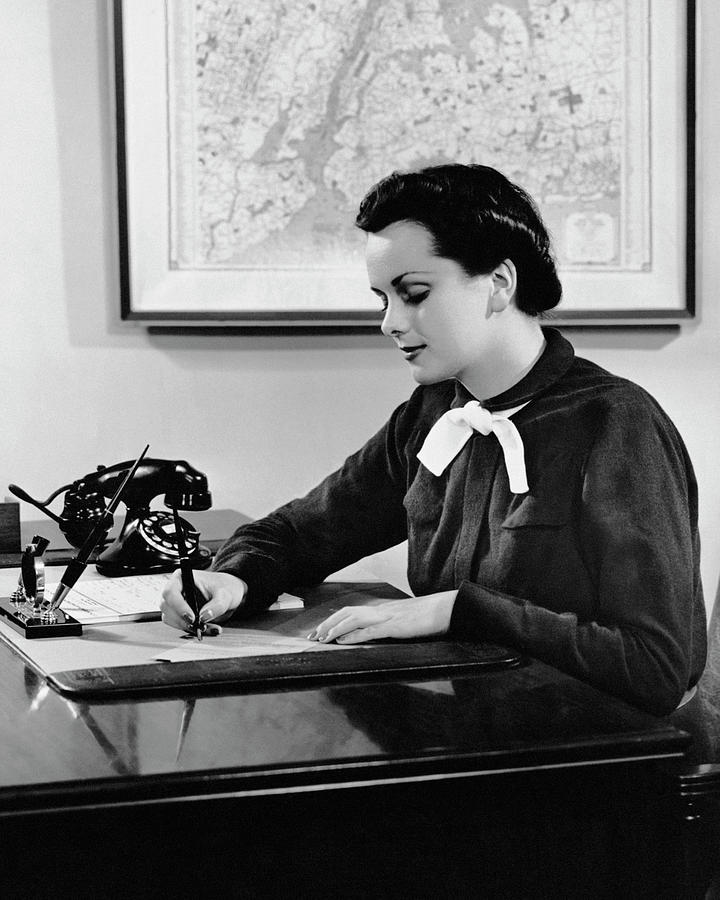 Woman Writing At Desk Photograph by George Marks