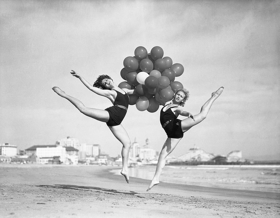 Women Doing Balloon Dance On Beach Photograph by Bettmann