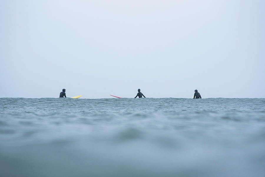 Women In A Surf Lineup During Winter Snow Photograph by Cavan Images ...