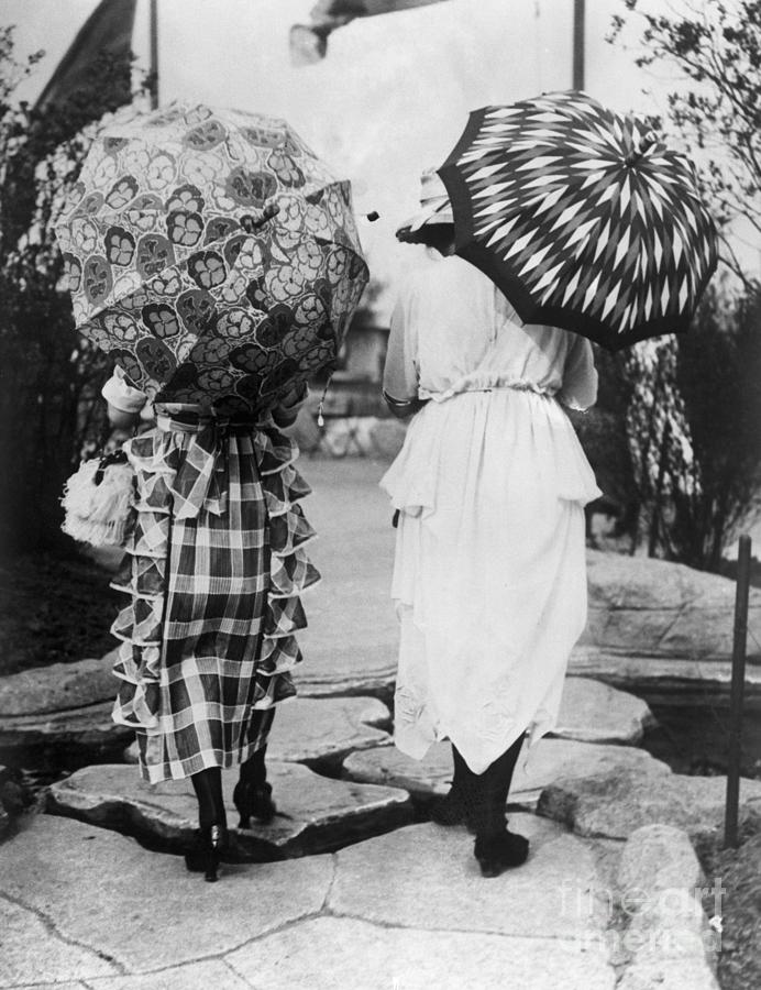 Women With Umbrellas Walking Photograph by Bettmann