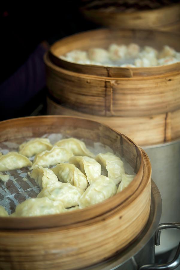 Wontons On Rice Paper In Steamer Baskets Photograph by Sebastian Schollmeyer