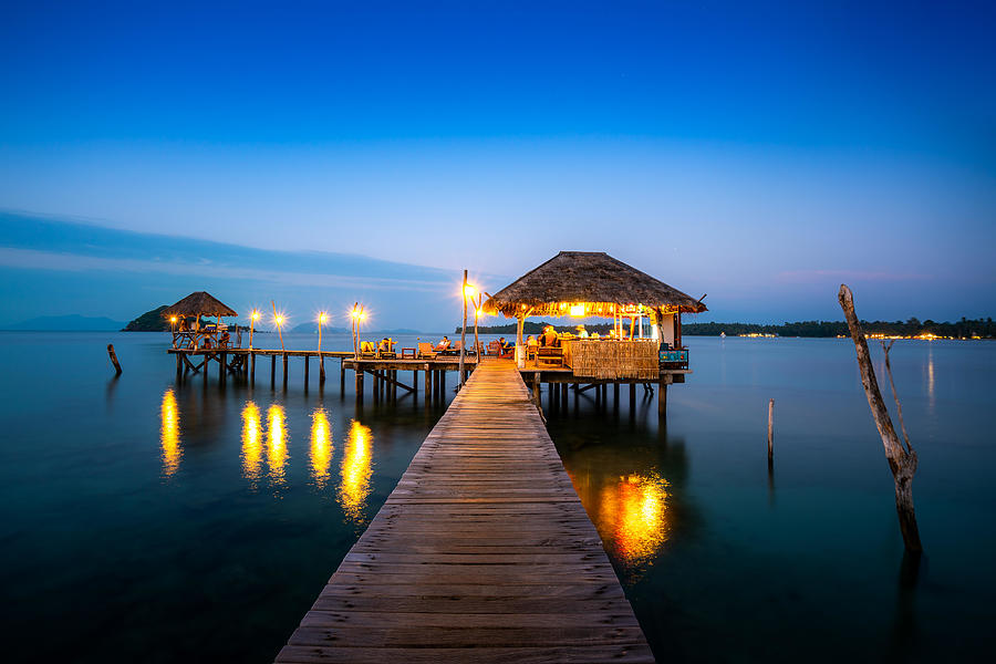 Summer Photograph - Wooden Bar In Sea And Hut With Night by Prasit Rodphan
