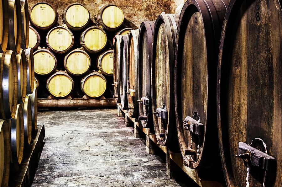 Wooden Barrels In A Wine Cellar barrique Cellar Photograph by Foto4food