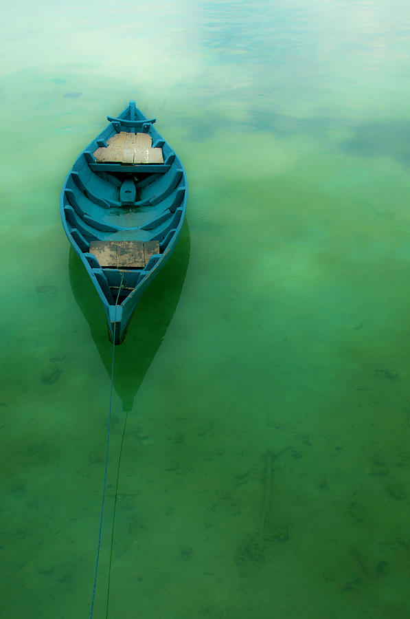 Wooden Boat On Crystal Clear Water Photograph by Zuraisham