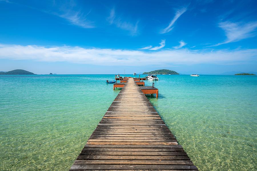 Summer Photograph - Wooden Boat Pier In Sea And Hut by Prasit Rodphan
