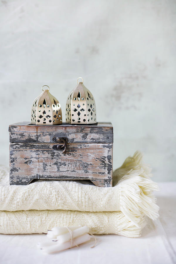 Wooden Box And Oriental Lanterns On Folded Blanket Photograph by Alicja Koll