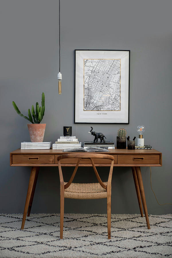 Wooden Chair And Desk Against Grey Wall Photograph by Magdalena Bjrnsdotter