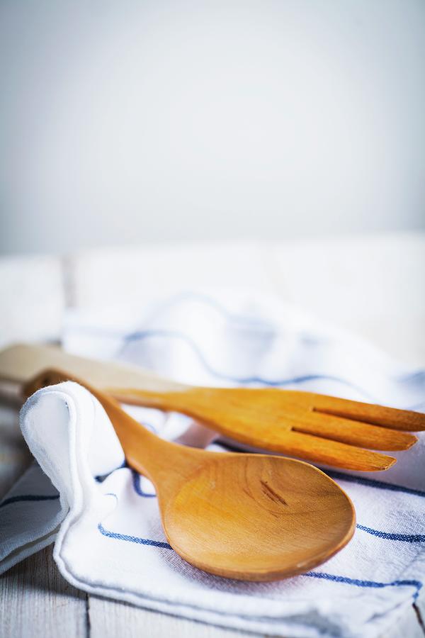Wooden Cooking Utensils On A Tea Towel Photograph by Theodosis Georgiadis
