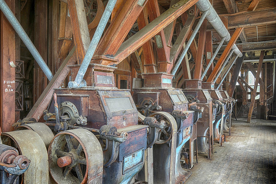 Wooden grist mill equipment in abandoned factory Photograph by Karen Foley