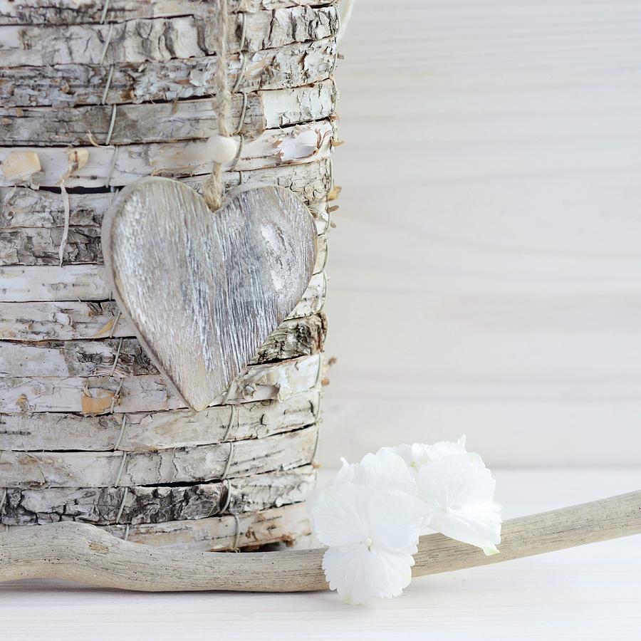 Wooden Heart Hanging On Stack Of Birch Discs Photograph by Sonia Chatelain