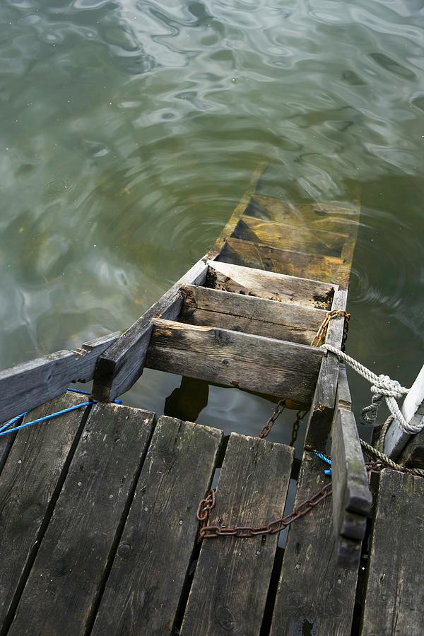 Wooden Ladder In Water, Tied To A Jetty Photograph by Per Magnus ...