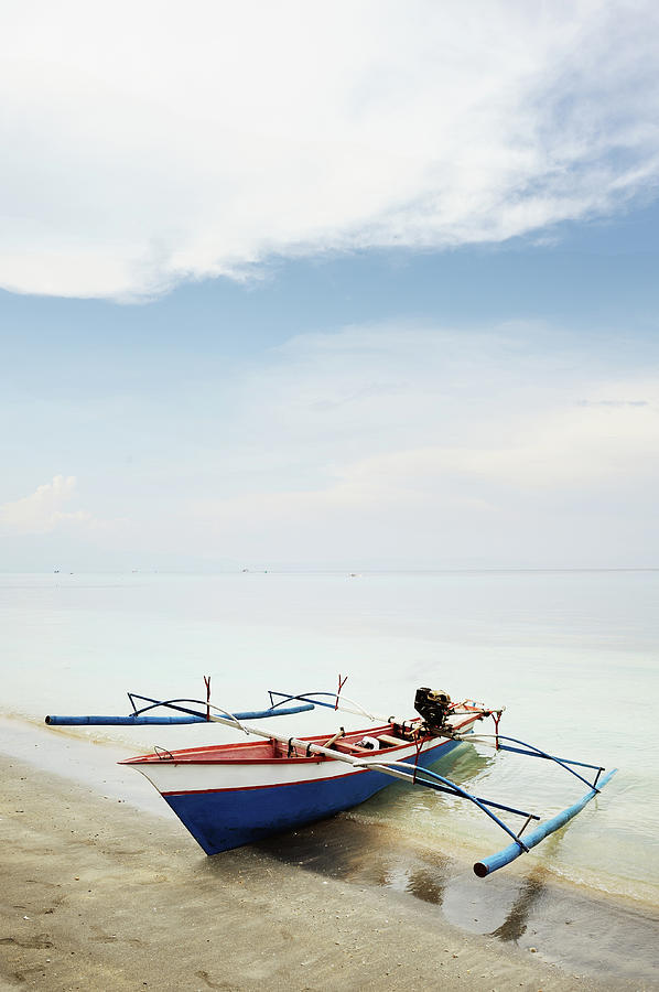Wooden Outrigger Boat On Shore Photograph by Carlina Teteris