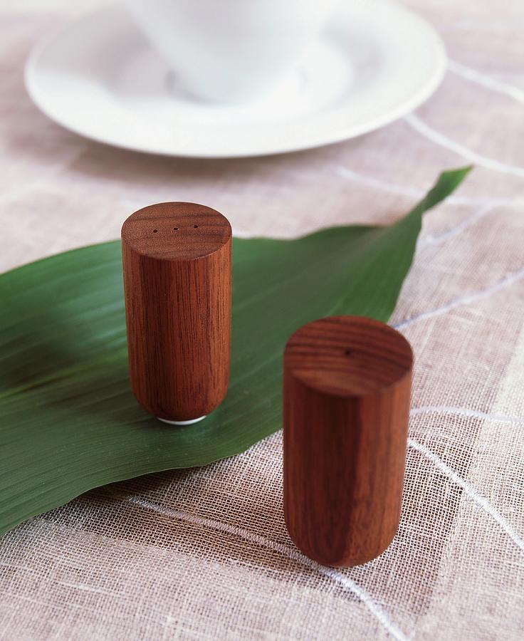 Wooden Salt And Pepper Shakers On Linen Tablecloth Photograph by Veronika Stark