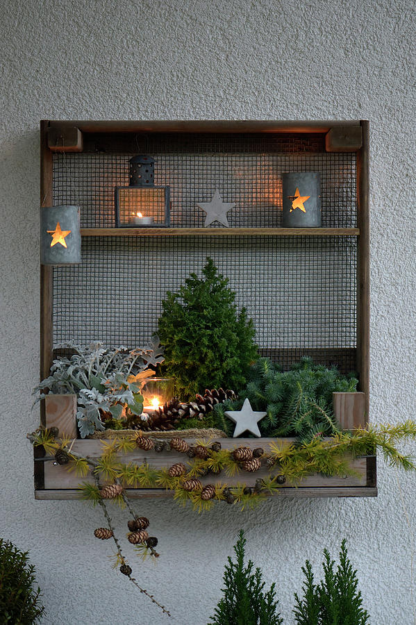 Wooden Shelf On The Terrace With Pre-christmas Decoration Photograph by Daniela Behr
