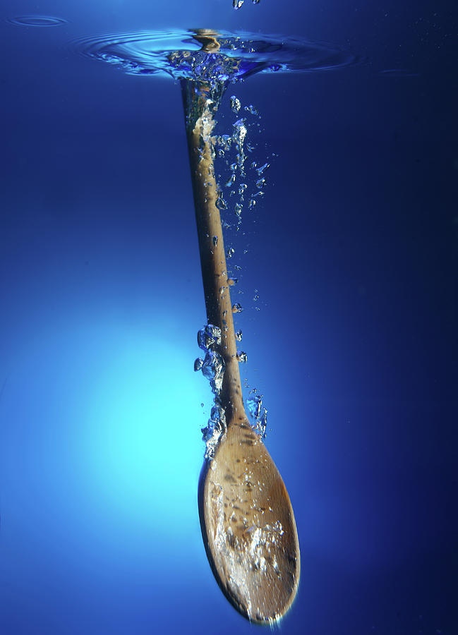 Wooden Spoon In Water Photograph by Terry Mccormick