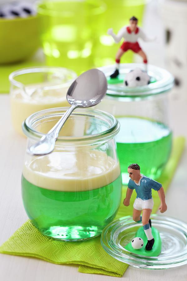 Woodruff Jelly With Vanilla Sauce And Football Decorations Photograph by Franziska Taube