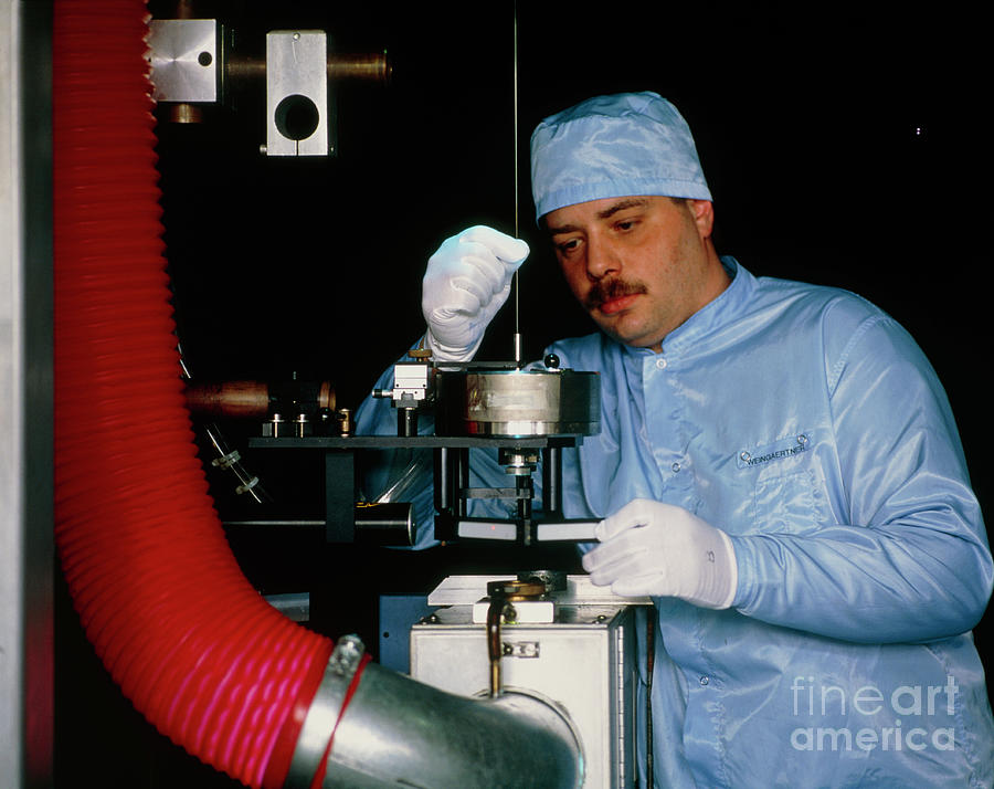 Worker Adjusting Glass Blank For An Optical Fibre Photograph by Maximilian Stock Ltd/science Photo Library