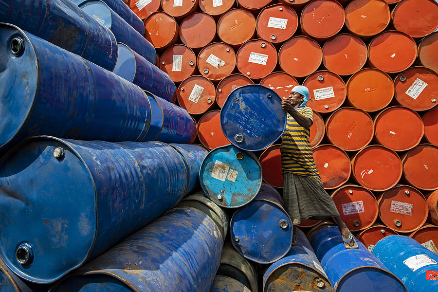 Up Movie Photograph - Worker Sorting Colorful Oil Drums by Azim Khan Ronnie