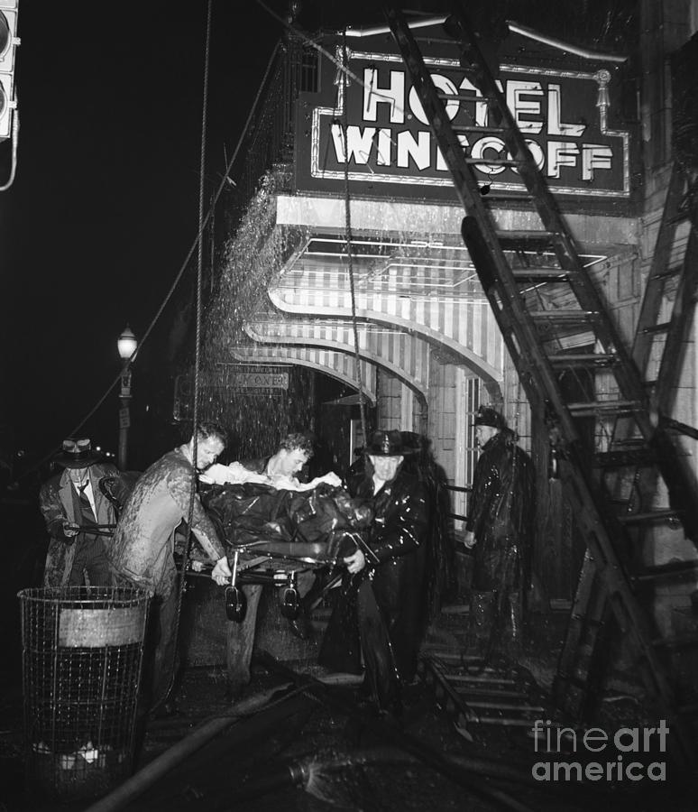 Workers Carry Victim From Burning Hotel Photograph by Bettmann